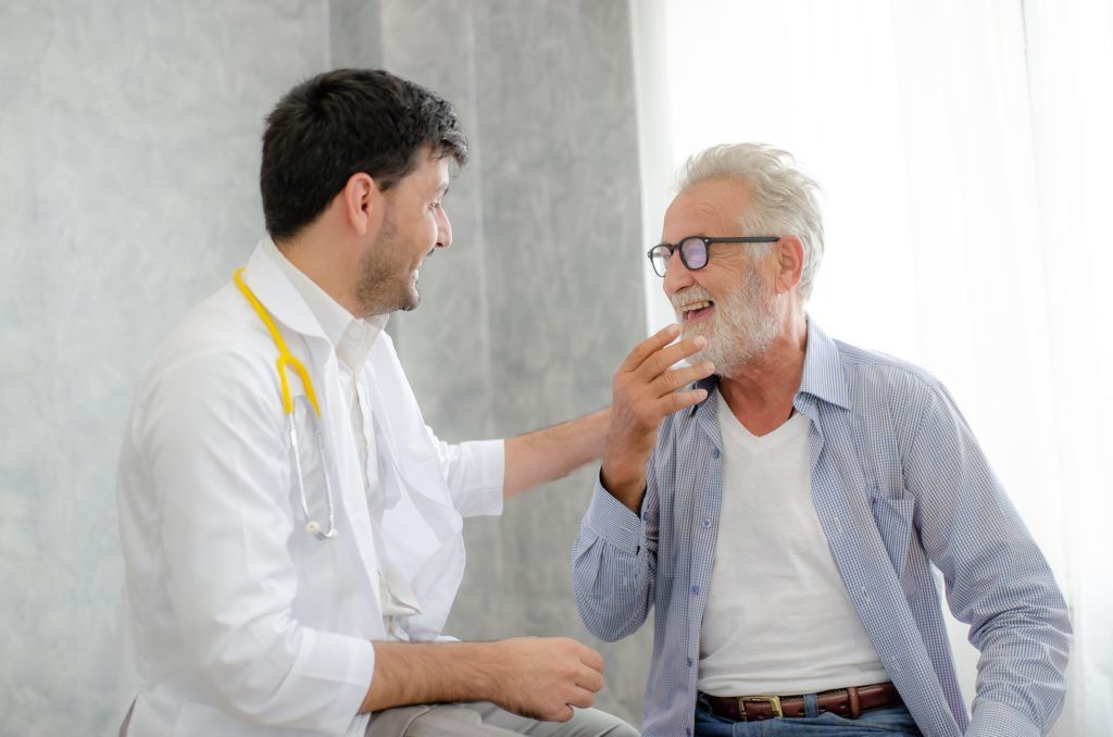 a man and his urology doctor discuss treatment
